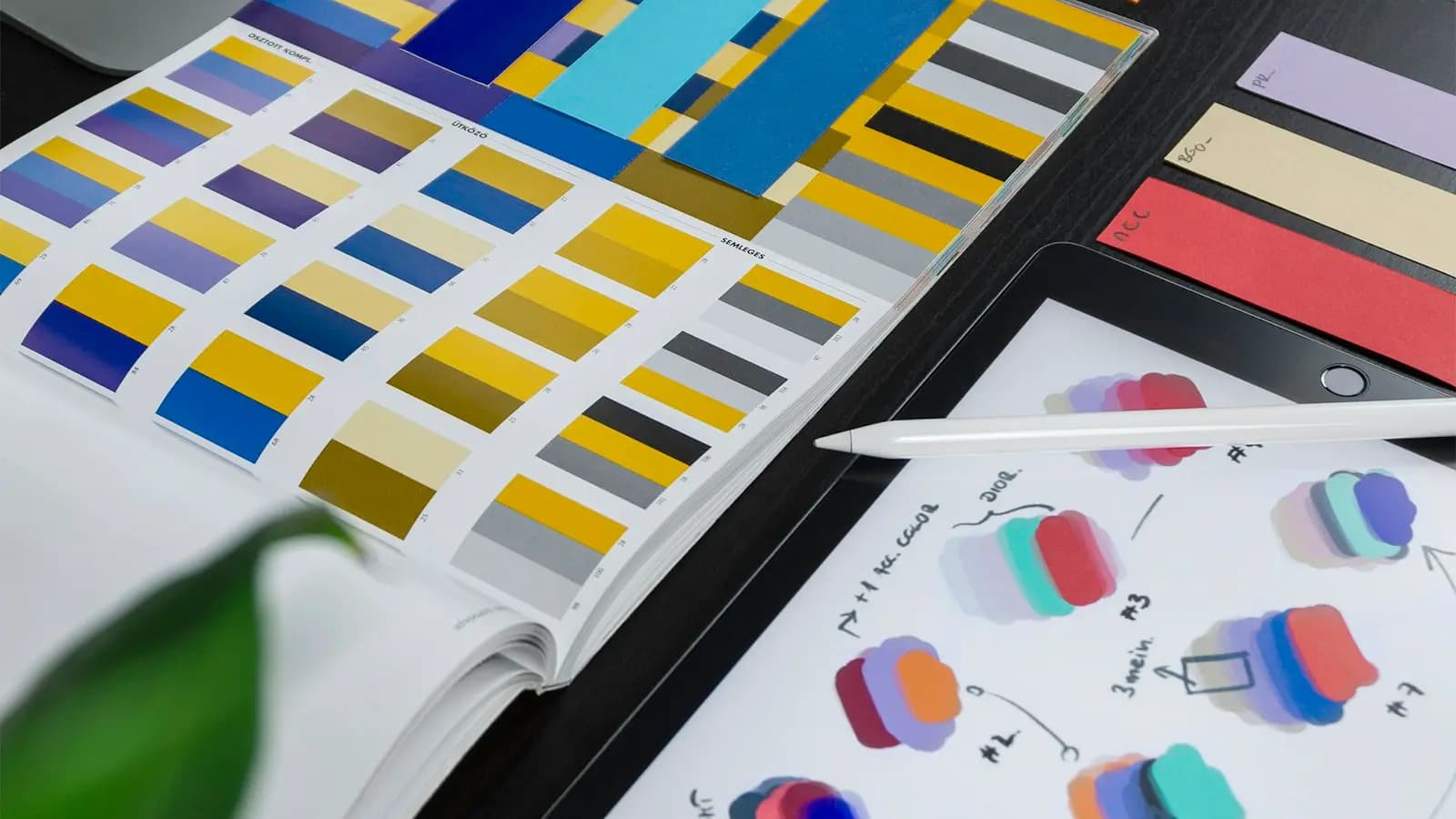 Colour swatches and design sketches on a tablet